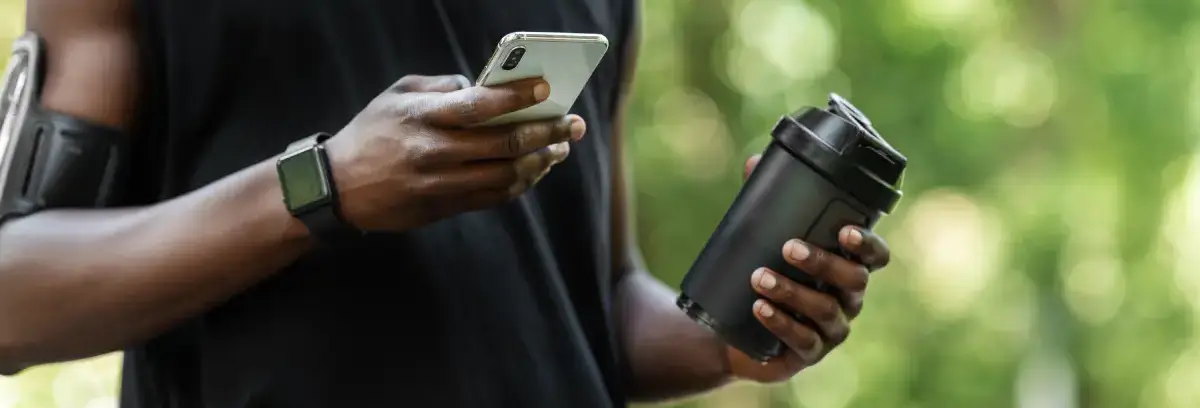 Person holding a phone whilst exercising